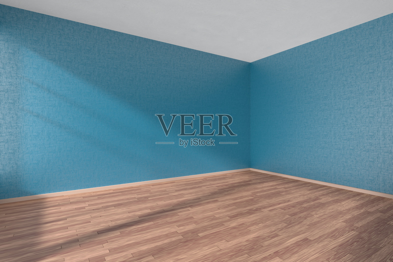 空房间，镶木地板和有纹理的蓝色墙壁照片摄影图片