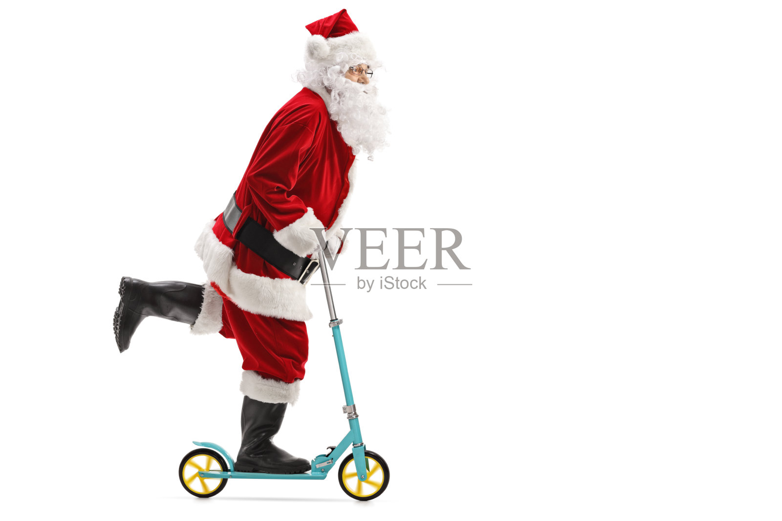 圣诞老人骑着滑板车照片摄影图片