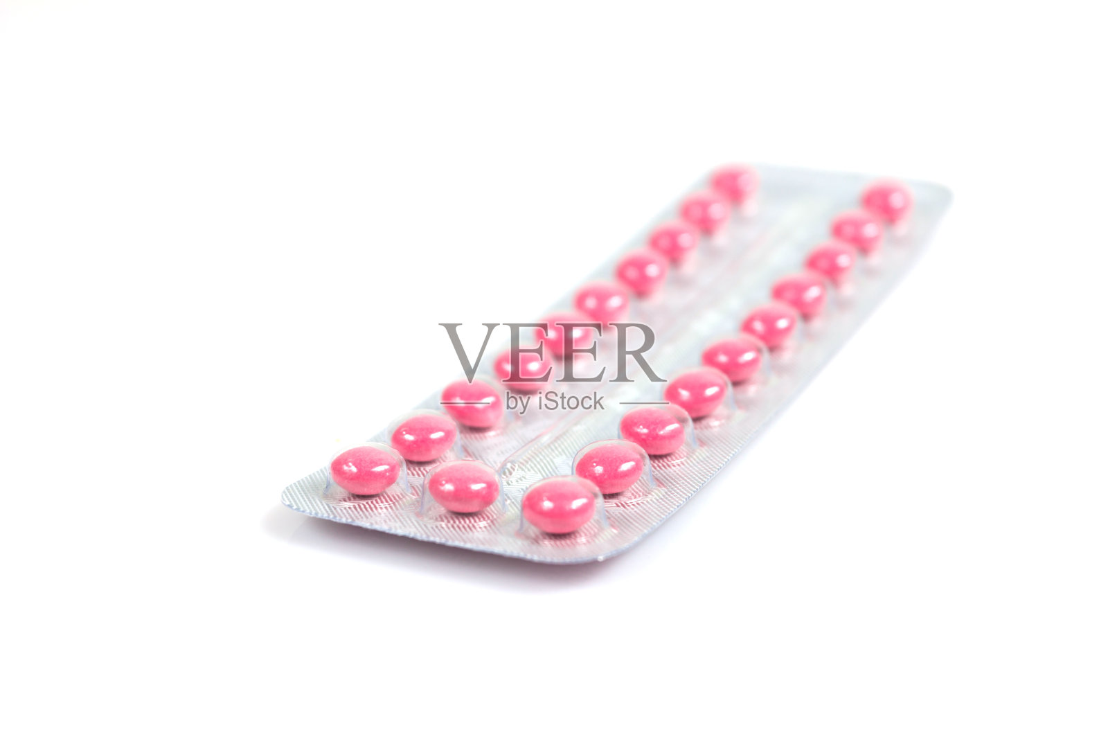 避孕药丸在白色背景上有选择性的焦点照片摄影图片