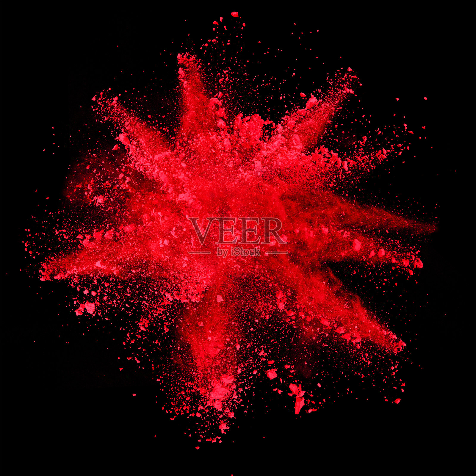 红色粉末在黑色背景上爆炸照片摄影图片