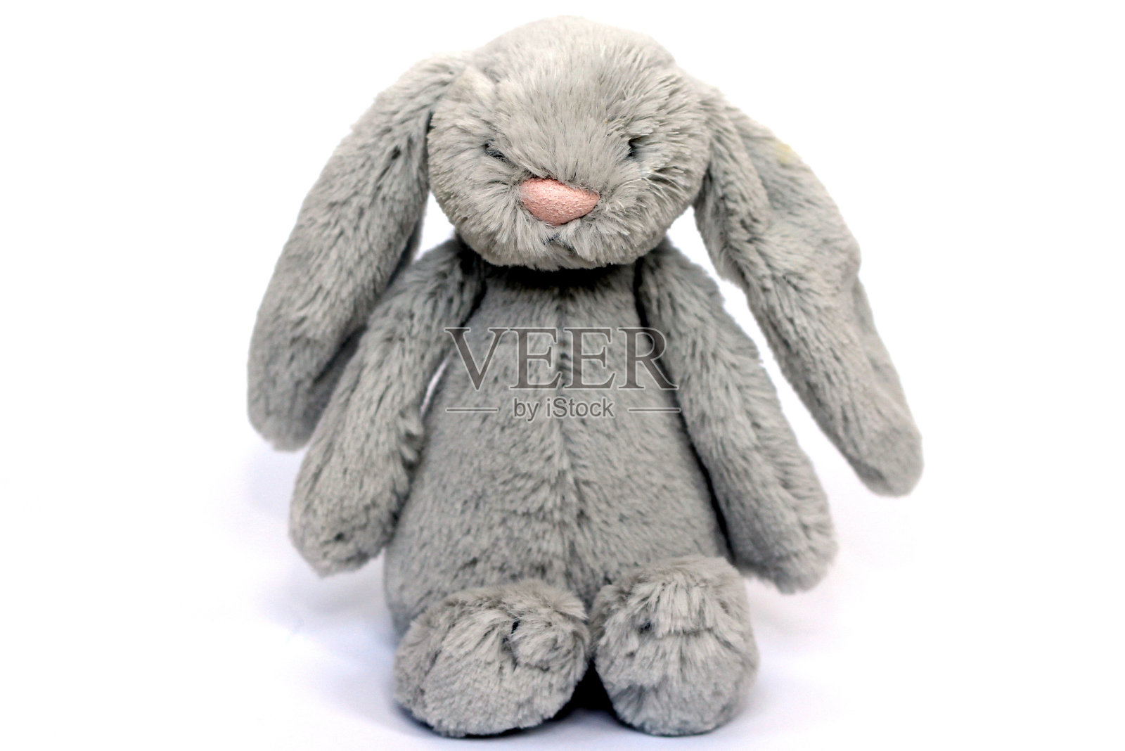 一个柔软毛茸茸的灰色兔子玩具照片摄影图片