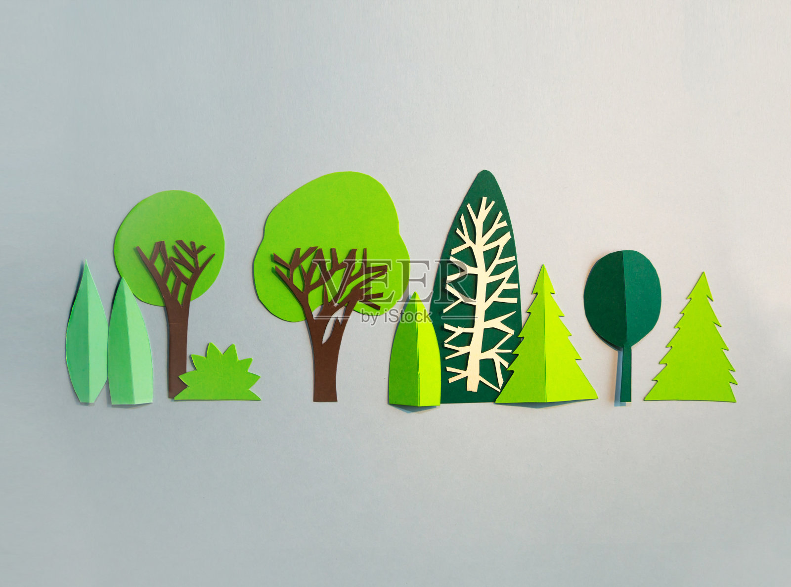 剪纸的设计。公园里有树。抽象的背景插画图片素材