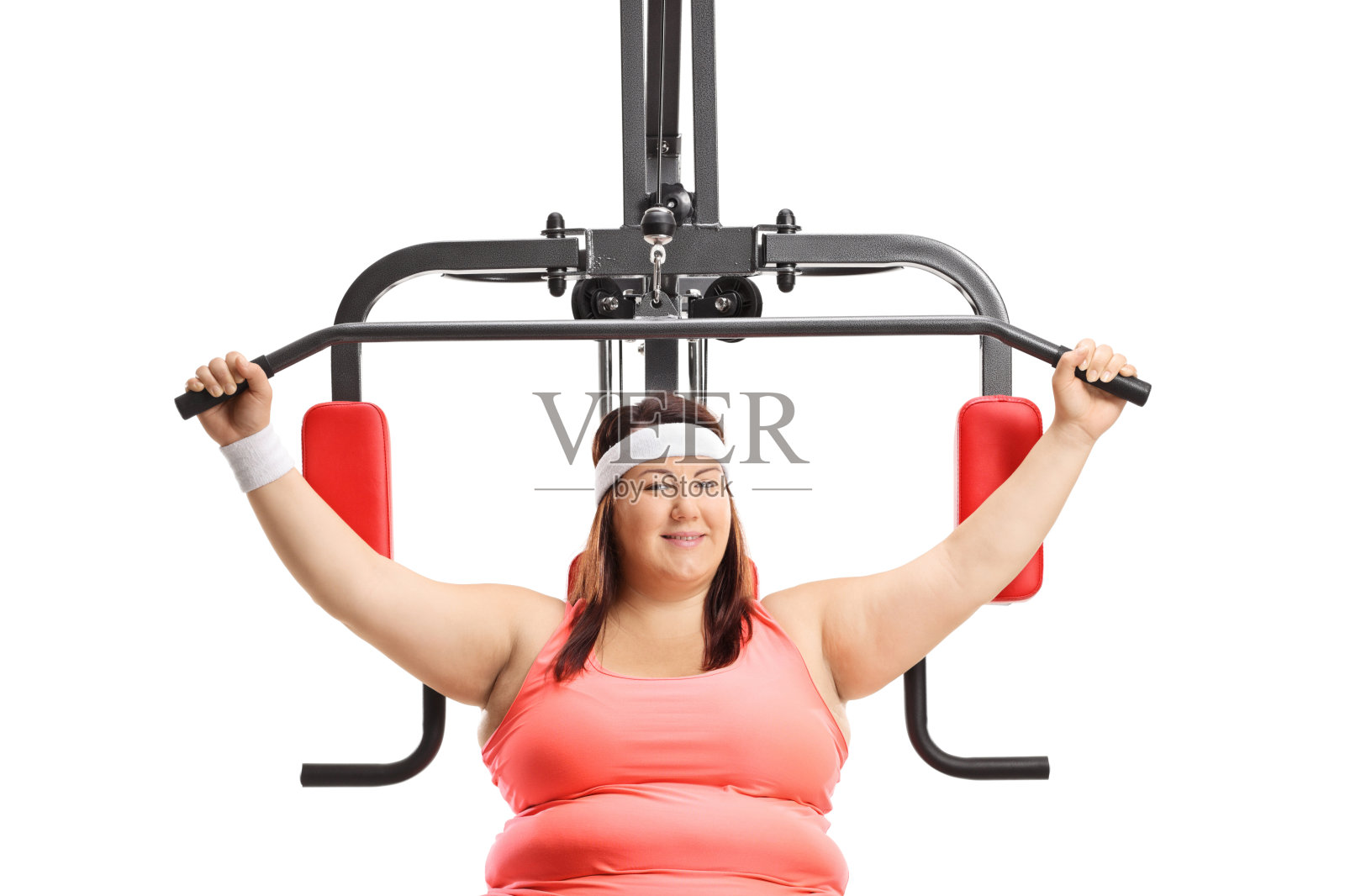 在机器上锻炼的超重女性照片摄影图片