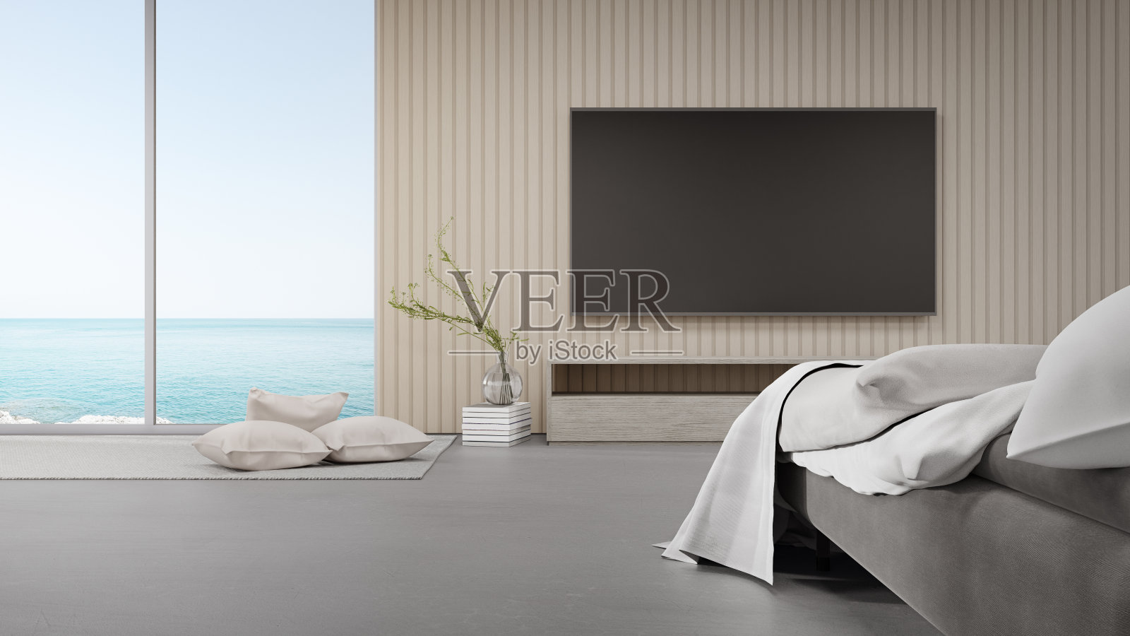 床在混凝土地板上明亮的卧室对着电视在现代海滩别墅或豪华酒店。照片摄影图片