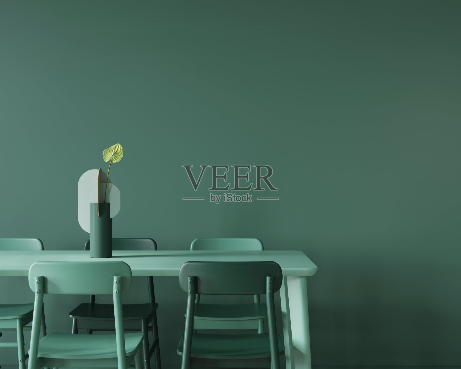 餐厅在单色绿色与一个大桌子，椅子和一个花瓶。照片摄影图片