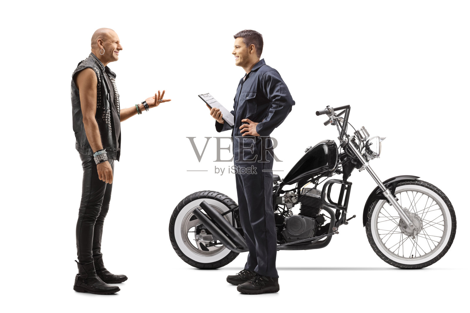 摩托车修理工和一个骑摩托的人说话照片摄影图片