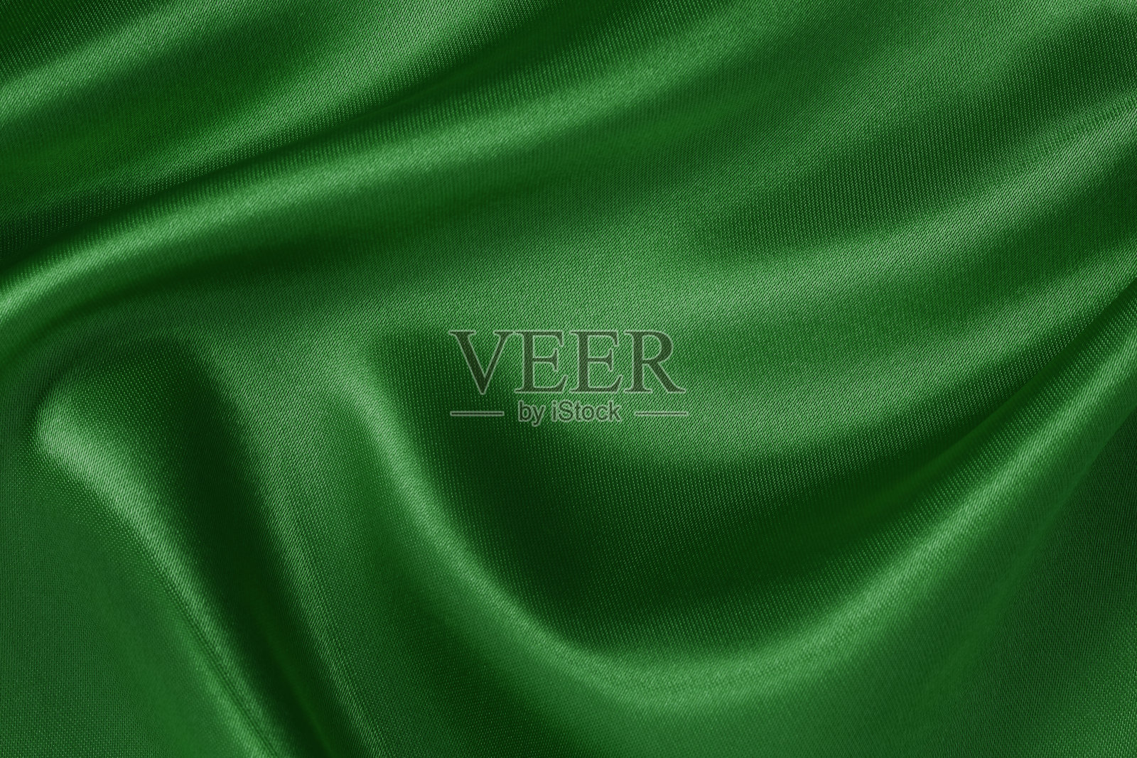 深绿色织物，布料质地为背景和设计艺术作品，美丽的皱褶图案的丝绸或亚麻。照片摄影图片