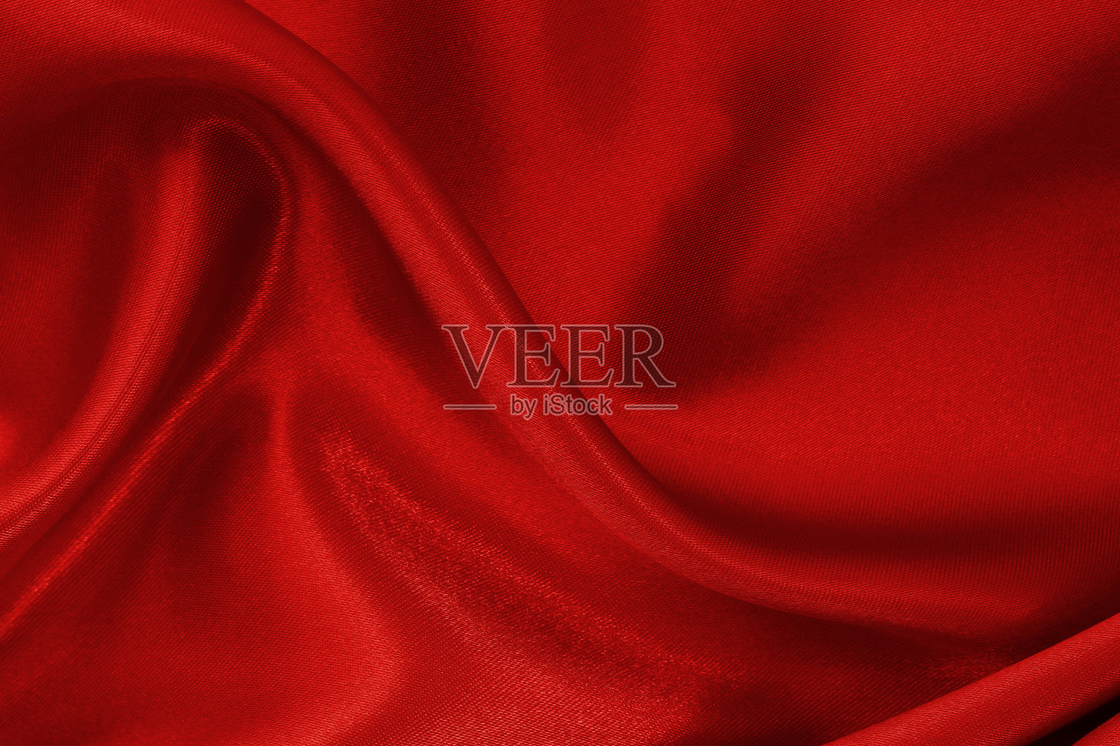 深红色的织物布料质地为背景和设计艺术作品，美丽的褶皱图案的丝绸或亚麻。照片摄影图片