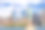 自由女神像和纽约天际线，曼哈顿金融区，世界贸易中心，纽约港水，炮台公园和蓝天。素材图片