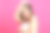 美丽的女人在毛巾孤立在粉红色的背景素材图片