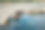 清晨，一名男子在温泉中放松，俯瞰格兰德河素材图片
